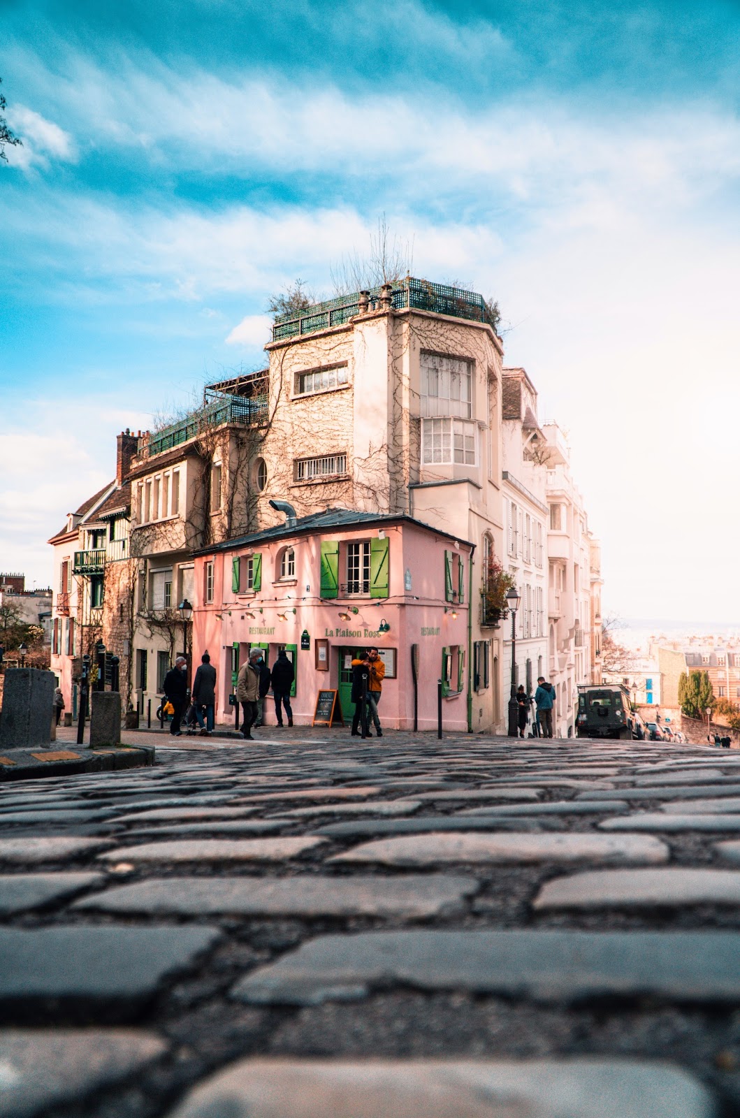 People strolling through Montmartre's charming streets with views of the city.
