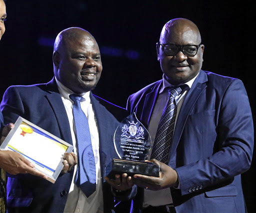 Premier David Makhura, right, poses with George Sono, the principal of Bokhoni Technical Schhol in Randburg yesterday.