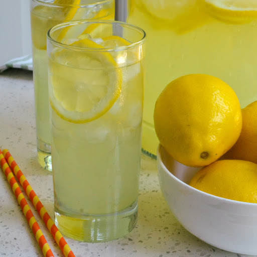 This Homemade Lemonade is the perfect balance of sweet and tart.  Make a batch of this refreshing ice cold lemonade today.