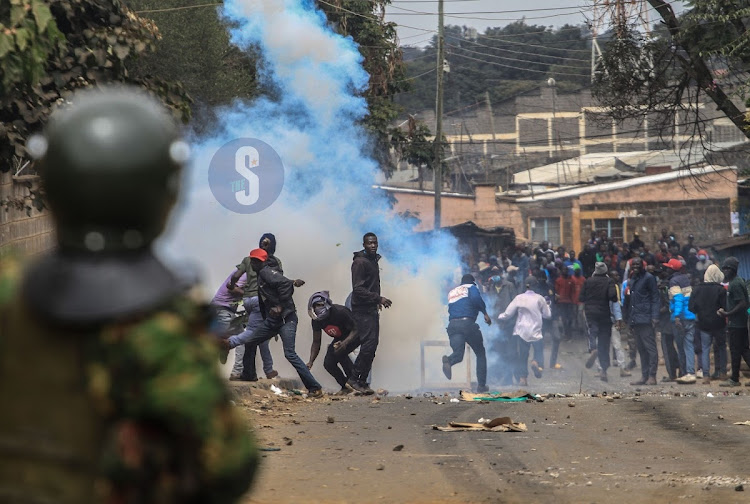 Azimio la Umoja Protestors engage Anti-riot Police Officer in Woodley Kibera during the coalition led high cost of living protest on July 19,2023.PHOTO/ENOS TECHE