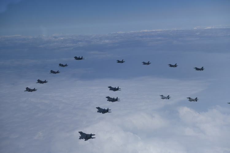 Jet fighters from U.S. and South Korea air forces conduct a formation flight during their military exercise in an unidentified location, South Korea, June 7, 2022.
