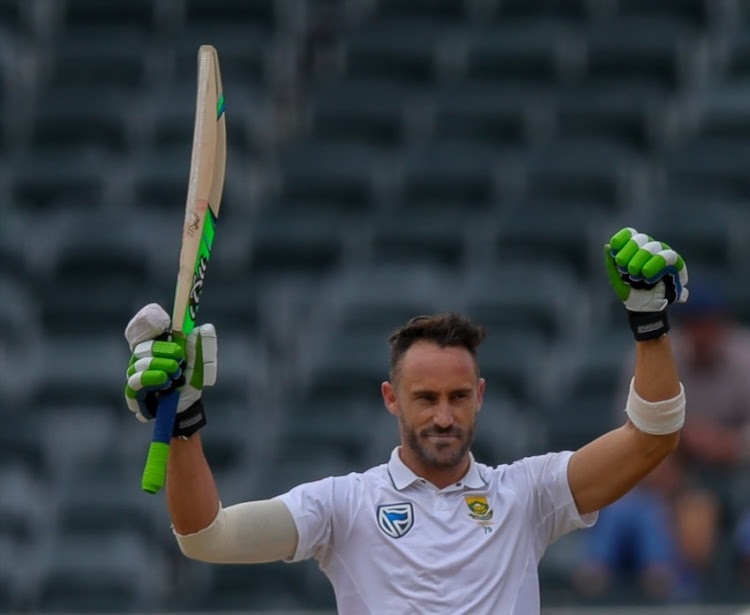 Faf du Plessis of South Africa raises his bat after achieving his 100 run mark during day 4 of the 4th Sunfoil Test match between South Africa and Australia at Bidvest Wanderers Stadium on April 02, 2018 in Johannesburg, South Africa.