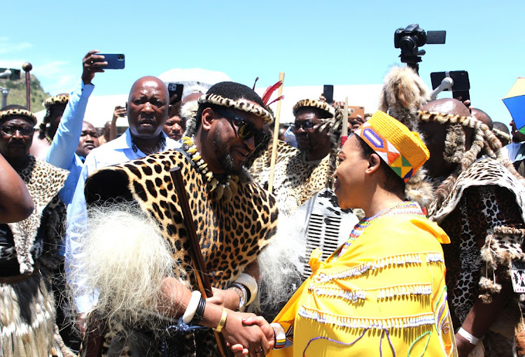 King Misuzulu kaZwelithini greets KwaZulu-Natal premier Nomusa Dube-Ncube at the commemoration of the Battle of Isandlwana. Dube-Ncube has announced that izinduna are going to finally receive the back pay they are owed.