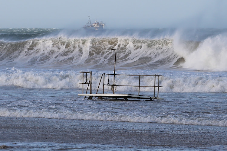 A huge storm with gale force winds drove long lines of huge waves down the coast, causing one death and damage to infrastructure and properties.