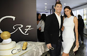 This handout picture released on December 15, 2013 by Foto Gestifute Media shows Portuguese footballer and current country captain Cristiano Ronaldo and his girlfriend Irina Shayk posing during a the inauguration of the CR7 museum dedicated his professional career, in Madeira.