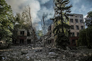 Smoke rises over the remains of a building destroyed by a military strike as Russia's attack on Ukraine continues in Lysychansk, Luhansk region, on June 17 2022. File photo.