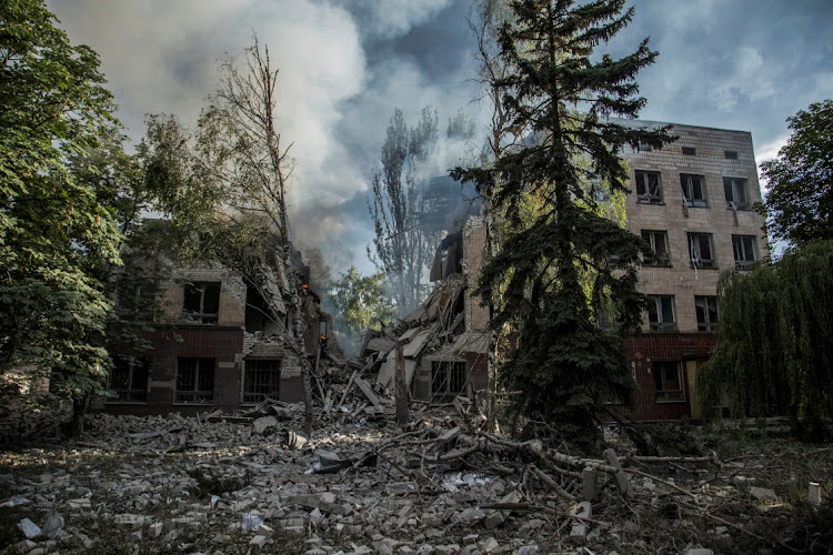 Smoke rises over the remains of a building destroyed by a military strike as Russia's attack on Ukraine continues in Lysychansk, Luhansk region, on June 17 2022. File photo.