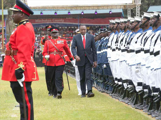 President Uhuru Kenyatta inspects a guard of honour mounted by the Kenya Defence Forces during Mashujaa Day celebrations at Kenyatta Stadium in Machakos County, October 20, 2016. /PSCU