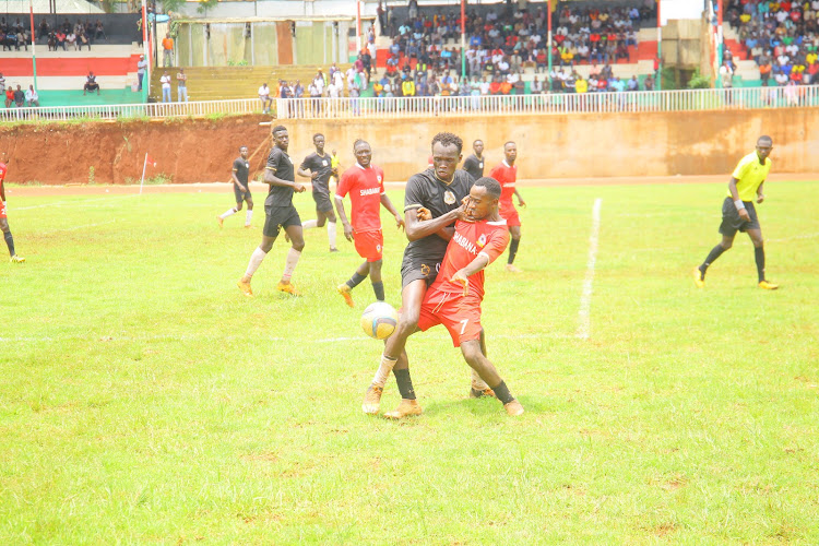 Isaac Otieno of Shabana battles for the ball with David Oduor of Mombasa Elites