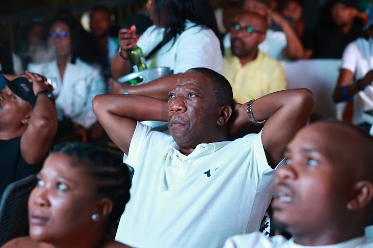 Fans watching Bafana Bafana and Nigeria at Disoufeng Pub Meadowlands Zone 10, Soweto.