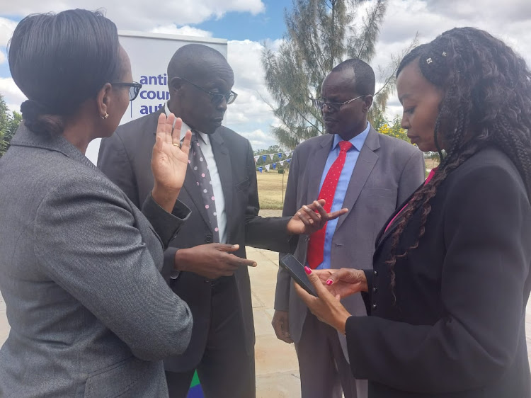 Anti Counterfeit Authority Acting Executive director Frida Kaberia (L), Machakos County Water CEC Maurice Alwanga and ACA chairperson Flora Mutahi at Machakos People's Park on Thursday, June 9.