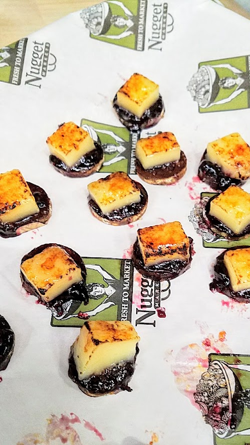 At the California Artisan Cheese Festival 2018 Best Bite Competition, Chris Stone representing Nugget Market Woodland used Lionza fro Fiscalini Cheese Co with some Kelly's marionberry and habanero jelly over an Olympia Provisions chorizo sausage.