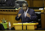 Finance minister Tito Mboweni gestures as he delivers his medium-term budget policy statement in parliament on Wednesday.