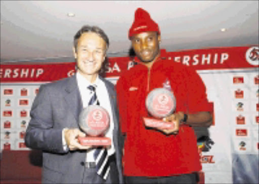 TOP DOGS: Coach of the month Muhsin Ertugral, left, and player of the month Sthembiso Ngcobo at the PSL offices yesterday. 09/02/09. Pic. Sydney Mahlangu. © Backpagepix.