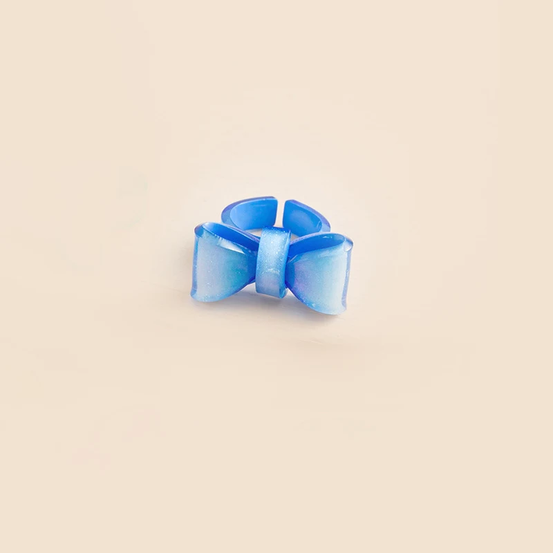 Candy-colored Bow Ring Adjustable Opening Cute Sweet. A charming and adjustable ring for a touch of sweetness and a deli