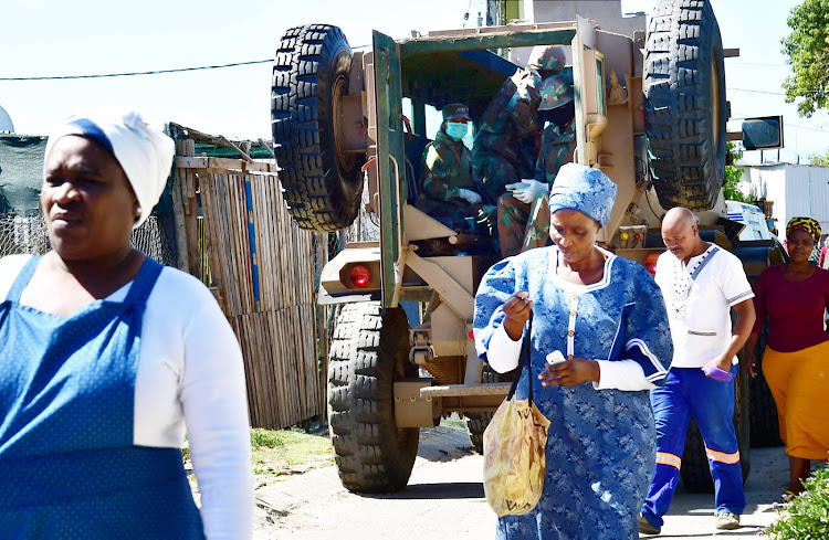 An SANDF vehicle patrols the streets of Airport Valley in Walmer Township on Sunday March 29 as the army rolled into town to support the police in overseeing the Covid-19 lockdown