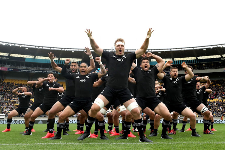 Sam Cane of the All Blacks performs the haka