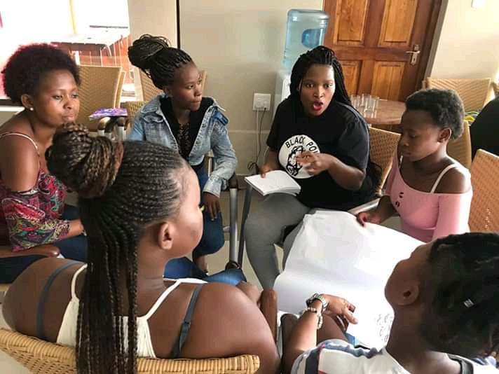 Zintle Mbola, centre, during a support group session on a two-day camp for young women from Walter Sisulu and Fort Hare universities.