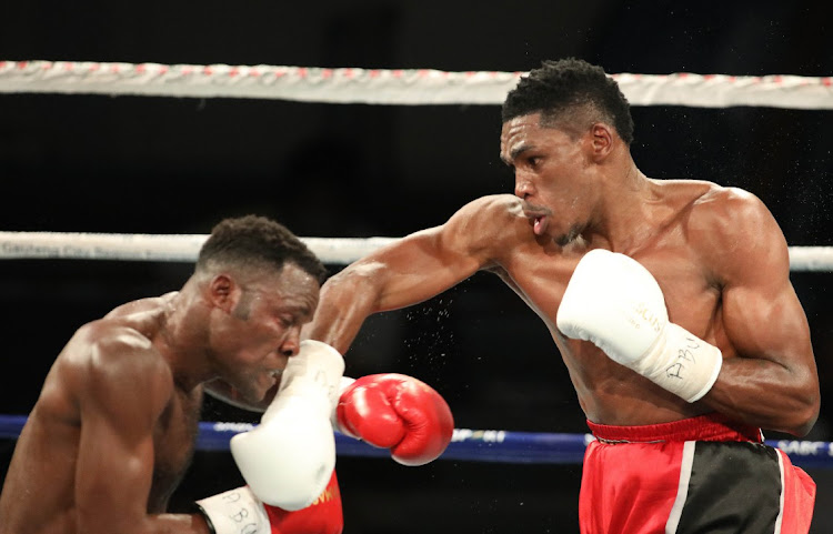 Thulani Mbenge lands a punch at Kuvesa Katembo of the DRC during their ABU Welterweight title in Soweto on Saturday.