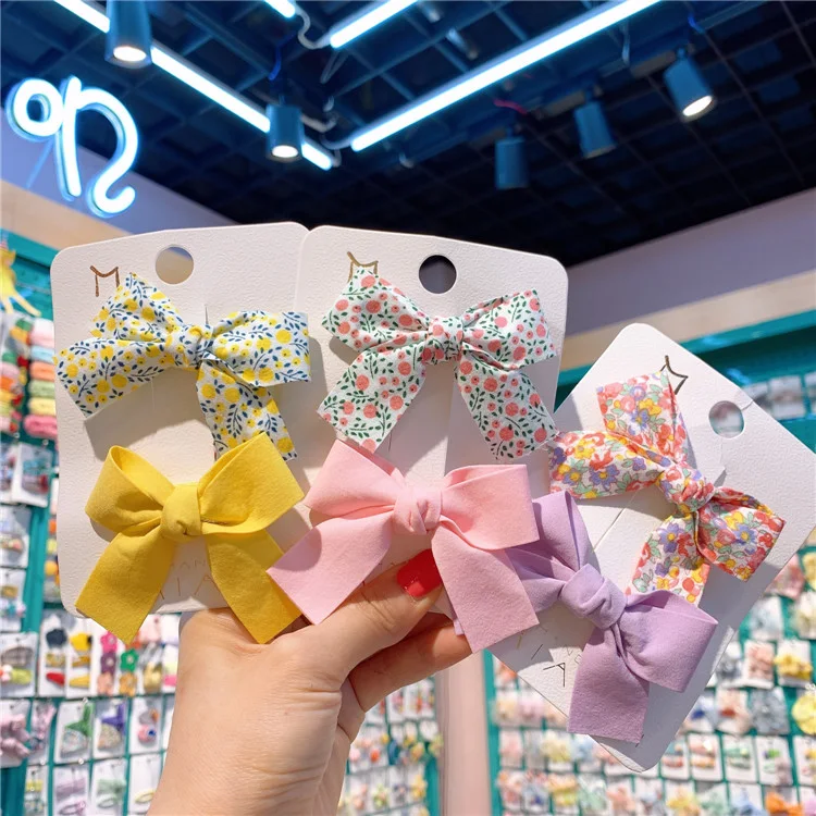 Barrettes à nœud floral frais pour enfants, couleurs macaron, clips à pression, pour des coiffures mignonnes et simples.