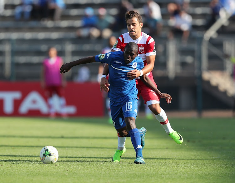 Aubrey Modiba of Supersport United pulled back by Ghazi Ayadi of Club Africain during the 2017 CAF Confederations Cup semifinal football match between Supersport United and Club African at Lucas Moripe Stadium in Pretoria, South Africa on 01October 2017.