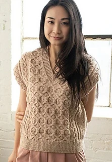 woman wearing a textured knit vest