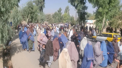 People hold a protest march against the Taliban's decision to force them to leave their homes in Kandahar, Afghanistan September 14, 2021, in this still image taken from video.