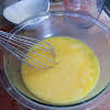 Thumbnail For Egg Yolks, Sugar, Lemon Juice, And Lemon Zest Whisked Together On A Bowl.