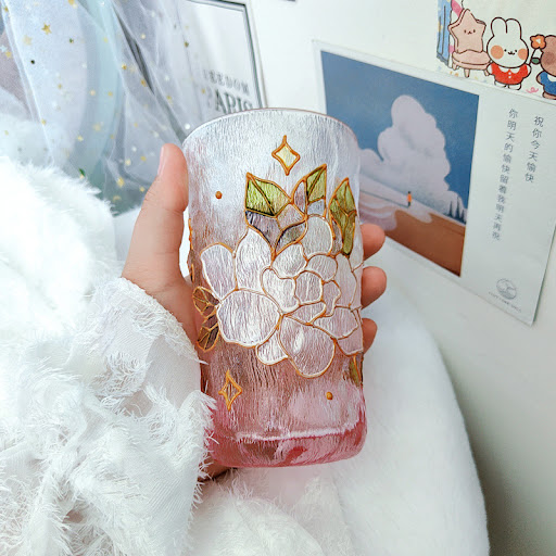 Title 3, Gold-painted hammered crystal glass cup with ar...