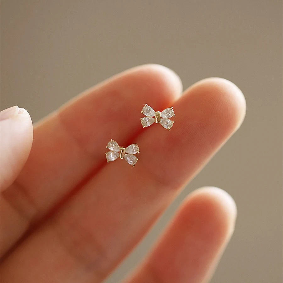 Boucles d'oreilles nœud en argent sterling S925 14K or, avec zirconias. Élégance et éclat pour toutes occasions, parfaites pour un cadeau.