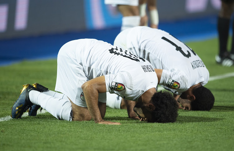 Mohamed Salah of Egypt celebrates his goal with Mohamed Elneny during the 2019 Africa Cup of Nations match against Uganda at Cairo International Stadium on June 30 2019.