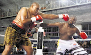 STEPPING UP: Wiseman Dlomo, left, and Buti Muravha exchange blows during their heavyweight clash at Wembley Arena in Johannesburg recently.PHoto: Bafana Mahlangu