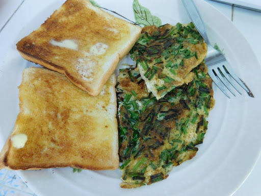 Chives Omelet with buttered toast.