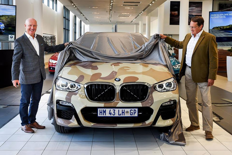 Tim Abbott, CEO of BMW Group South Africa and Sub-Saharan Africa, presented Arrie van Deventer, founder of the Rhino Orphanage, with one of two BMW X3s.