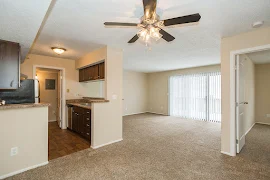 Dining room overlooking the living room with carpet throughout 