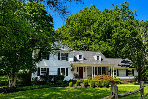 Buy this luxury house in Great Falls (United States) - White house with porch, lush garden