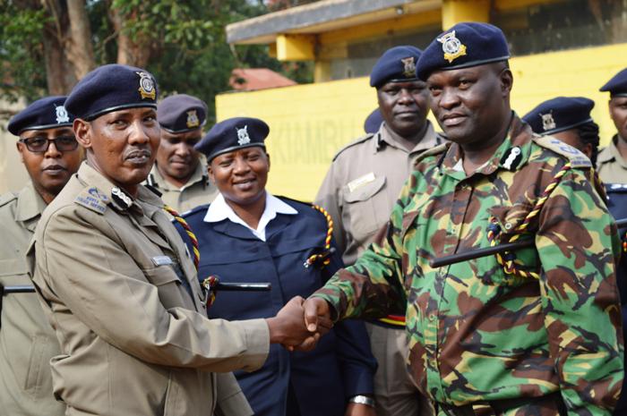 New Kiambu county police commander Ali Nuno is welcomed by outgoing commander Adiel Nyange at the Kiambu police station, Kiambu town, on Thursday