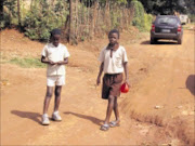 STRENUOUS WALK: A pupil walks through a badly damaged to Marumofase Primary School outside Tzaneen in Limpopo.  22/03/2009. Pic. Michael Sakuneka.  © Unknown.