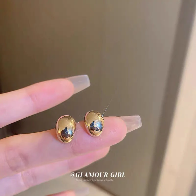 Simple women's silver needle gold bean earrings, elegant and understated. Perfect for everyday wear adding a subtle touc