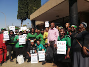 Resident and members of the ANCWL protest outside the Kempton Park magistrate's court on Thursday.