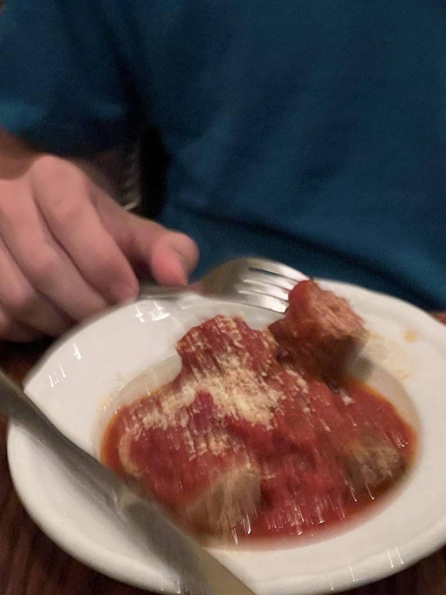 Side of gf sausages in a thick and chunky red sauce