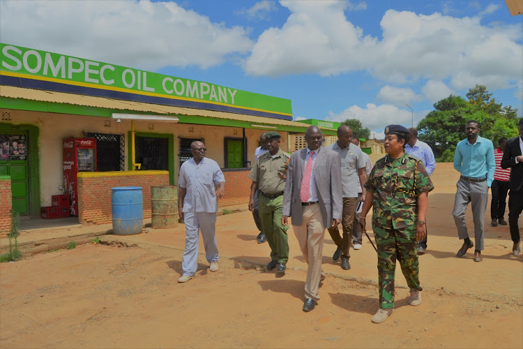Kitui acting county commissioner Jackson ole Chuta and Kitui county police commander Lydia Ligami when they visited the Wikililye petrol station said to be on a road reserve