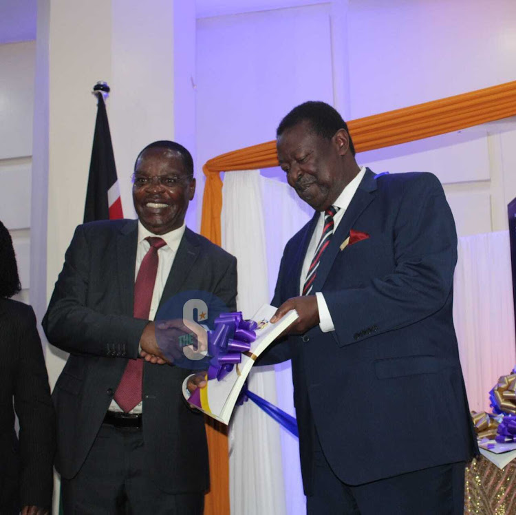 EACC Chairperson, Dr. David Oginde receives a copy of the report from prime cabinet secretary, Musalia Mudavadi during the launch of the EACC 2023-2028 strategic plan at KICC, Nairobi on September 26, 2023.