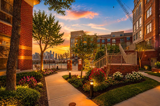 Exterior of residential buildings at sunset - Buy this luxury apartment / penthouse in West New York, 1 bedroom