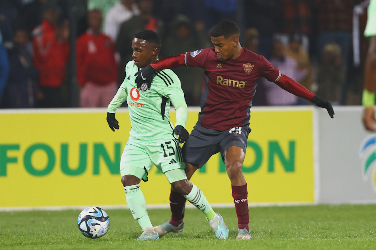 Ndabayithethwa Ndlondlo of Orlando Pirates is challenged by Jayden Adams of Stellenbosch FC in their DStv Premiership match at Danie Craven Stadium in Stellenbosch on August 5 2023.