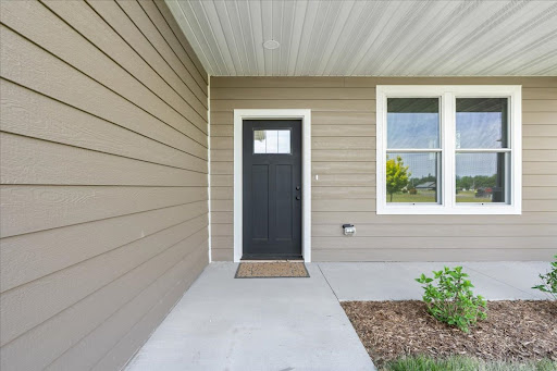 House entrance with black door and window - House purchase in Lake City, 3 bedrooms