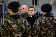 French President Emmanuel Macron, right, and Switzerland President Alain Berset, left, inspect the guard of honour of the Swiss army in Bern, Switzerland, on November 15 2023. France's defence ministry said on Sunday it had successfully test-fired an M51.3 long-range ballistic missile, boosting the counrtry's nuclear deterrence capabilities. 