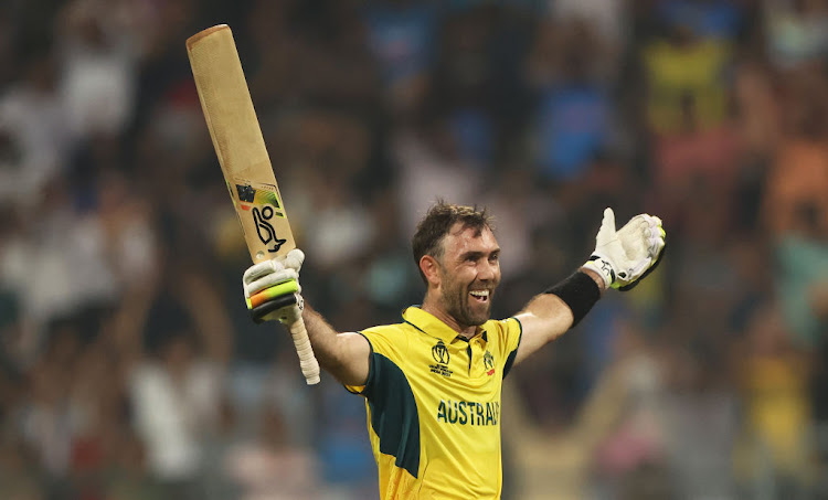 Glenn Maxwell of Australia celebrates after hitting a six for the winning runs to finish their 2023 World Cup win over Afghanistan unbeaten on 201 at Wankhede Stadium on November 7, 2023 in Mumbai, India.