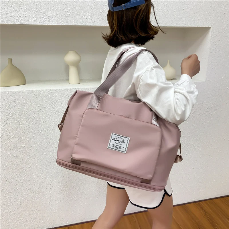 Multi-pocket handtas voor dames, waterdicht en lichtgewicht. Grote capaciteit handbagage ideaal voor korte reizen, functioneel en praktisch.