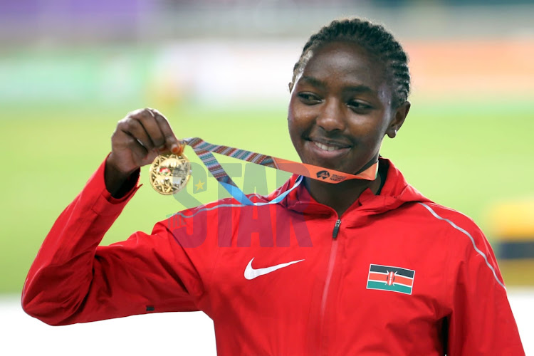 Teresiah Gateri celebrates with her Gold medal after winning in the 3000m at the world Athletics U20 championships being held at the Moi International Stadium Kasarani on August 19, 2021. Photo/ Fredrick Omondi